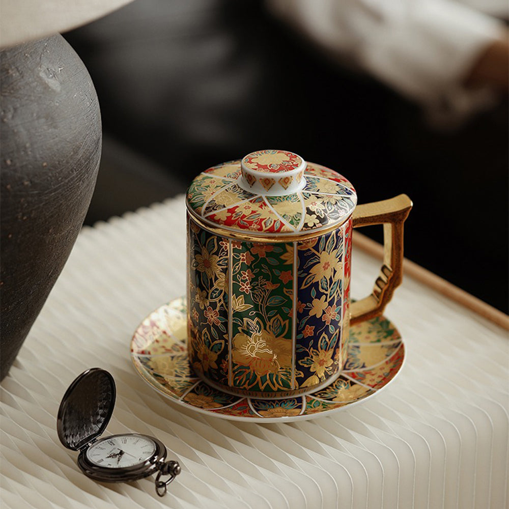 Elegant ceramic tea mug with embossed gilded handle on a wooden table