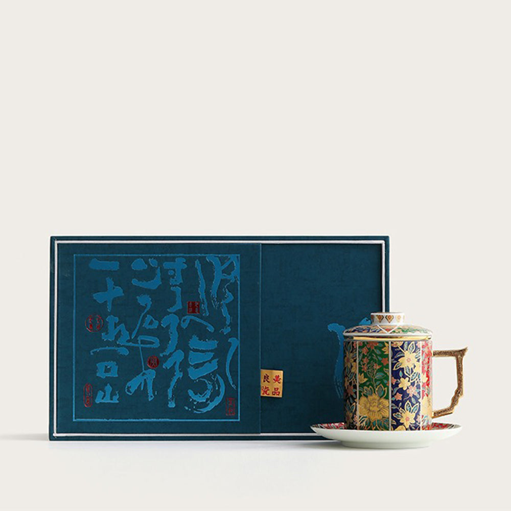 Elegant ceramic tea mug with embossed gilded handle on a wooden table