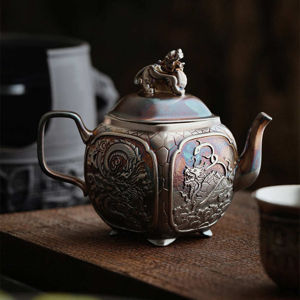 Silver teapot pouring tea smoothly, showcasing its practical use and stylish design.