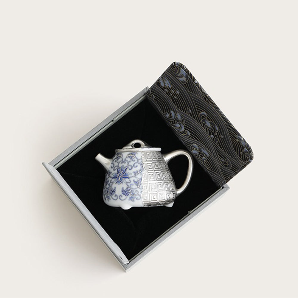 The teapot displayed in its beautiful gift box, perfect for gifting on special occasions.