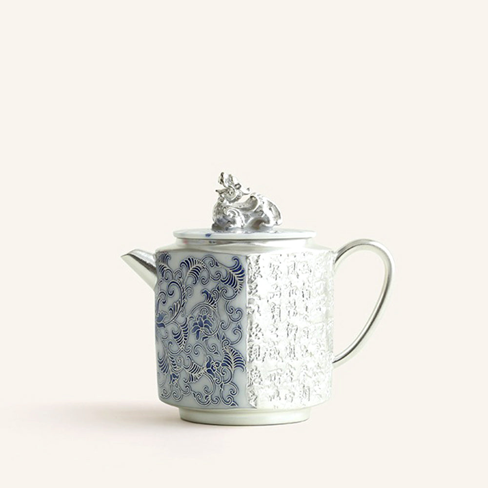 Close-up of the elegant blue and white silver plated teapot showcasing its detailed craftsmanship.