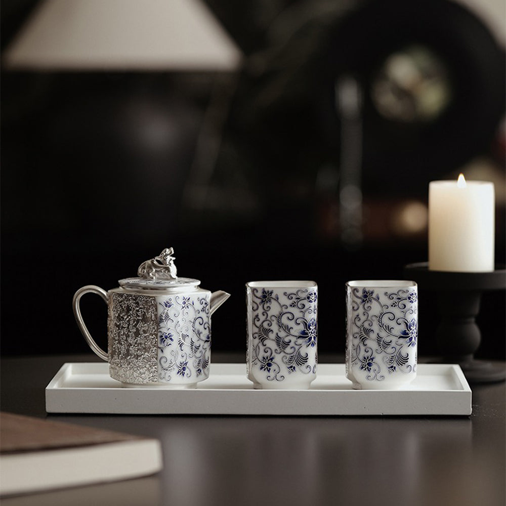Close-up of the elegant blue and white silver plated teapot showcasing its detailed craftsmanship.