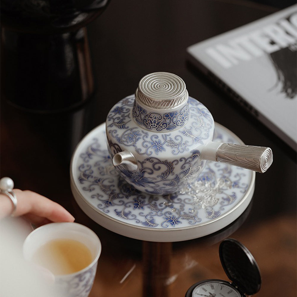 Elegant tea infuser teapot with traditional Chinese design in a cozy setting