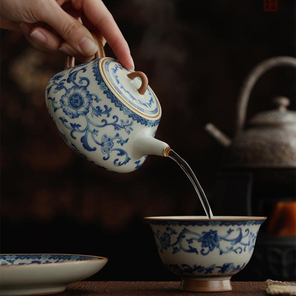 Elegant blue and white Ruyao teapot showcasing intricate designs from a side angle.