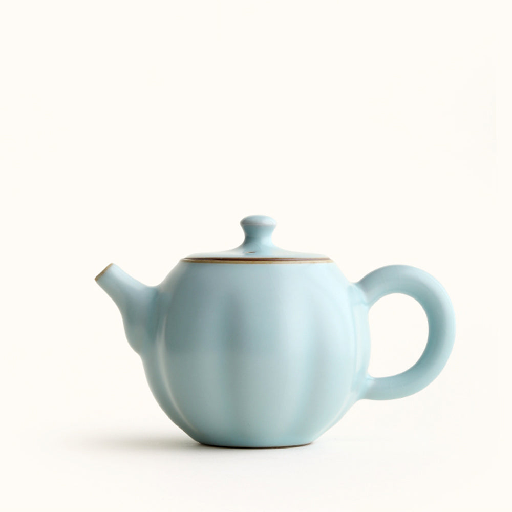 Front view of sky blue Ruyao porcelain pumpkin teapot with jade-like glaze