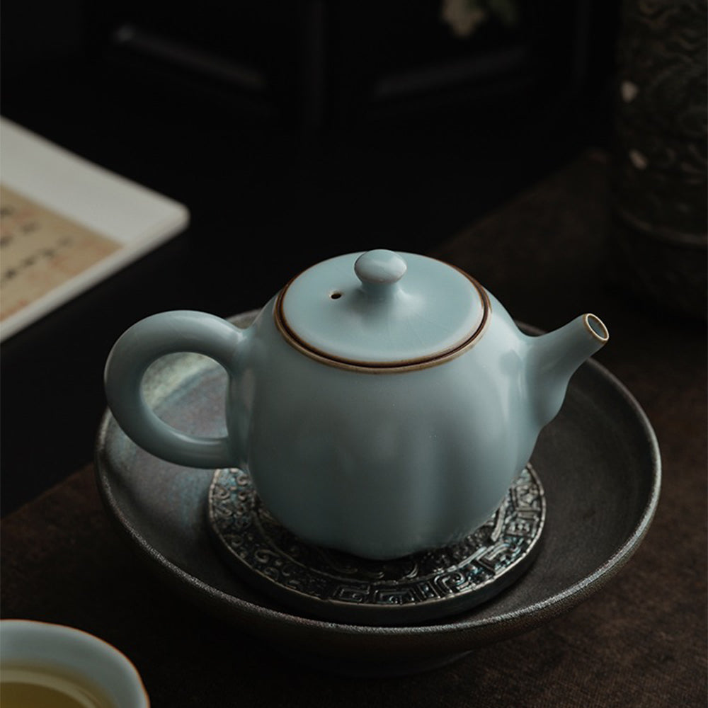 Front view of sky blue Ruyao porcelain pumpkin teapot with jade-like glaze