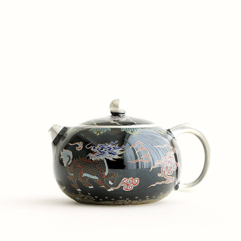 Elegant black teapot with Kirin design, showcasing smooth lines and intricate details.