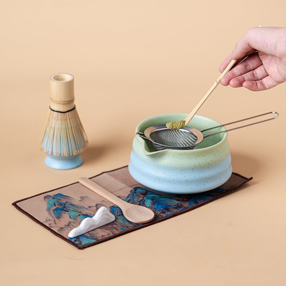 Bamboo whisk included in the Japanese matcha tea set, perfect for creating smooth foam.