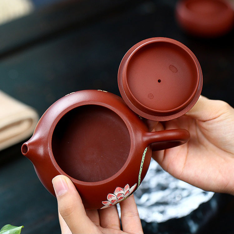 Two beautifully crafted tea cups from the Yixing tea set, polished for a smooth finish.