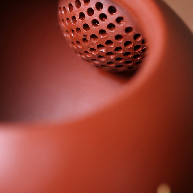 Close-up of the Yixing teapot spout, demonstrating the fine details and quality of the clay.