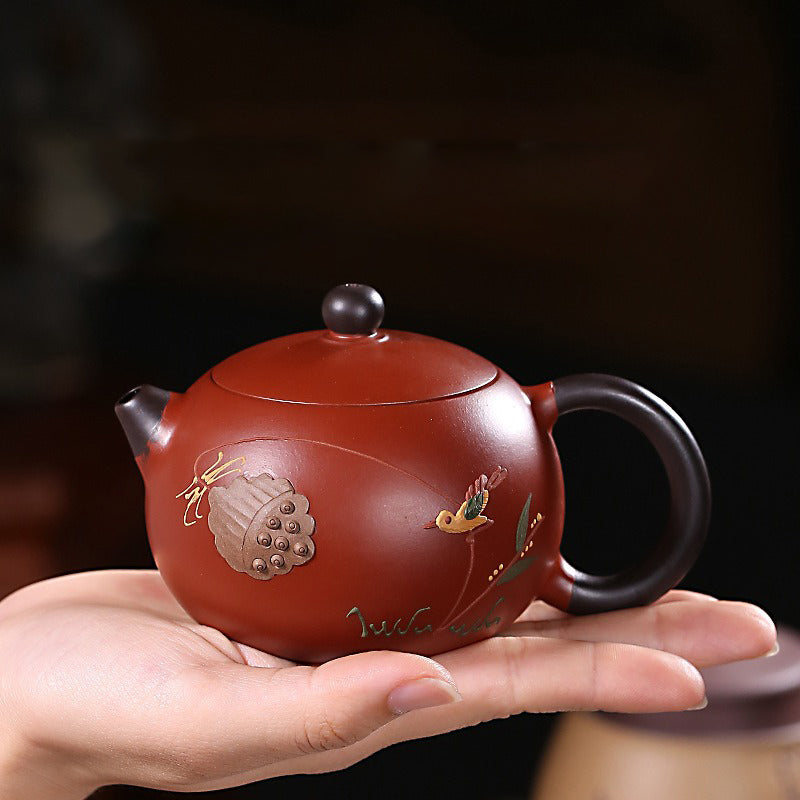 Yixing Red Clay Xi Shi Lotus Teapot from the side, highlighting its smooth finish and craftsmanship.