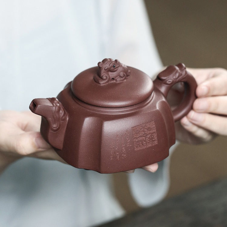 Close-up of the Yixing teapot highlighting its unique purple clay texture and craftsmanship.