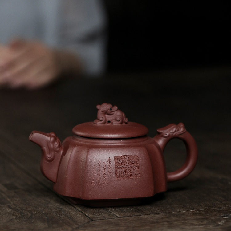 Close-up of the Yixing teapot highlighting its unique purple clay texture and craftsmanship.