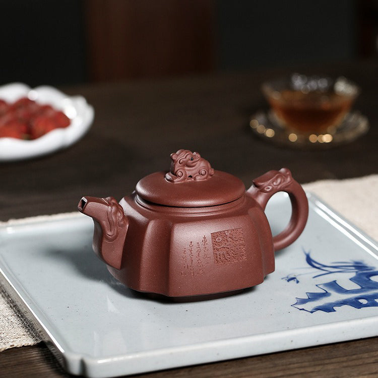 Yixing purple clay teapot in use, demonstrating its capacity and elegant design during a tea ceremony.