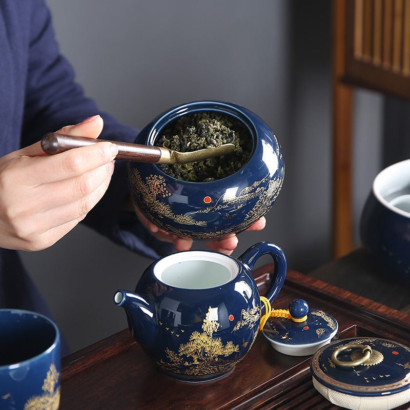 Elegant blue and white porcelain tea set with intricate relief carvings, perfect for traditional Chinese tea brewing