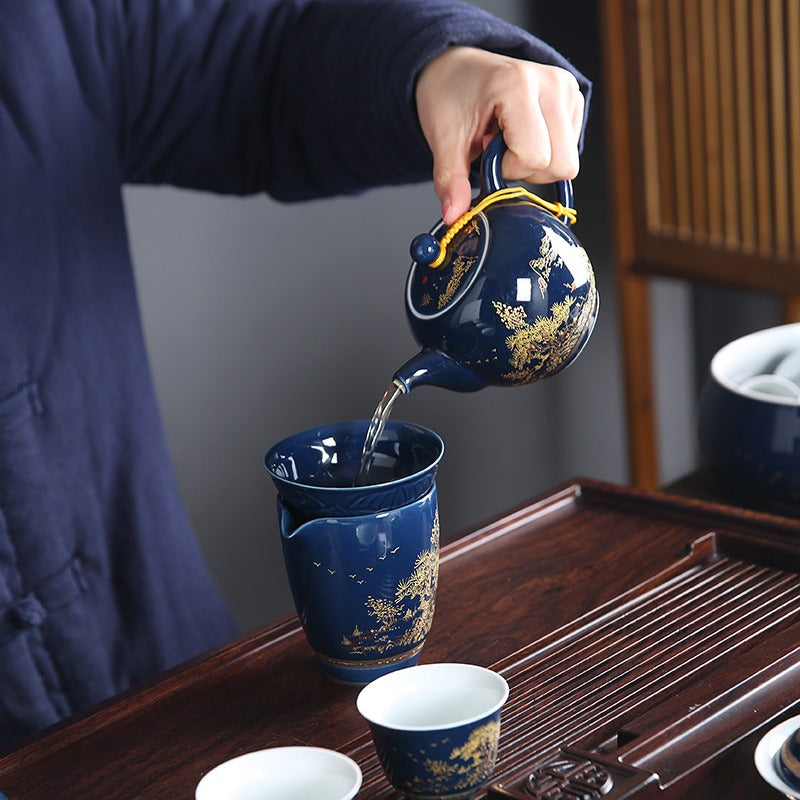 Set of handmade Chinese porcelain tea set with gaiwan, cups, and strainer, ideal for gong fu tea ceremonies