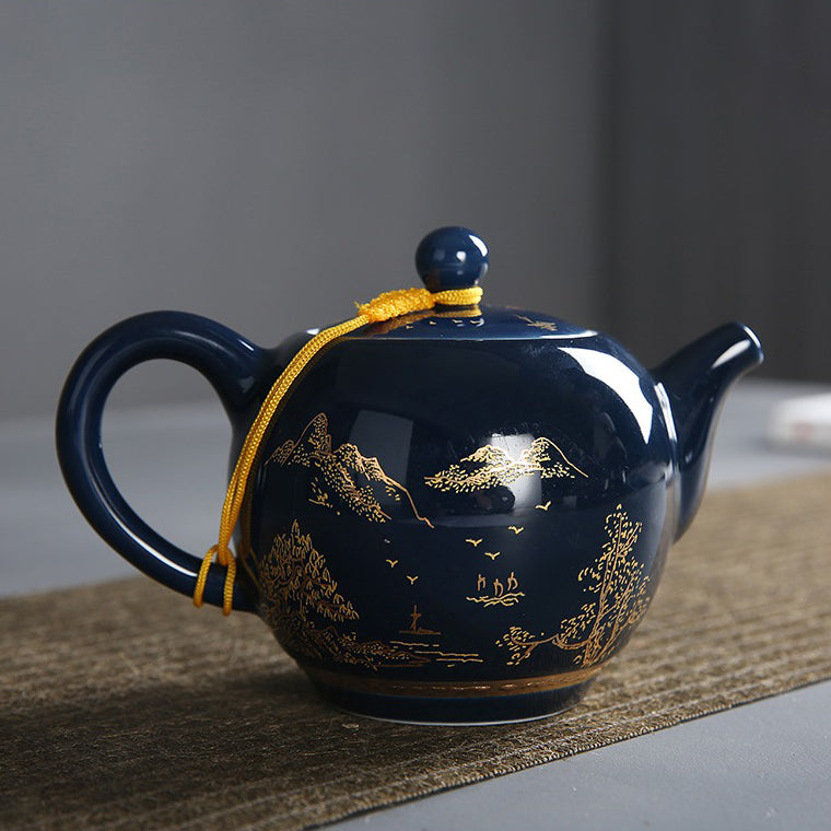 Close-up of a blue and white Chinese tea set, showcasing detailed craftsmanship and glossy finish