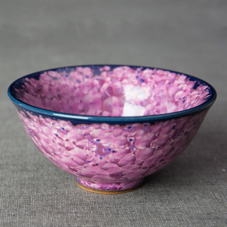 Close-up of the Jianzhan tea cup highlighting its unique texture and beautiful purple glaze.