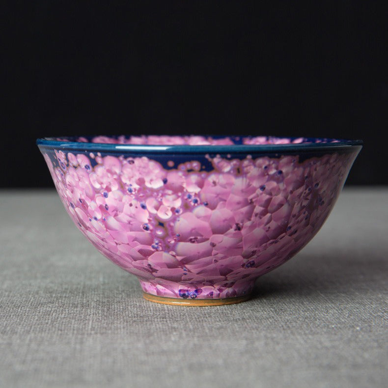 Close-up of the Jianzhan tea cup highlighting its unique texture and beautiful purple glaze.