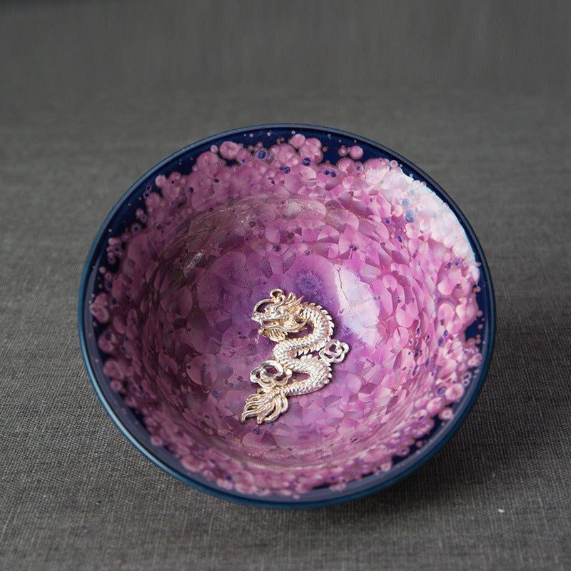 Side view of the elegant handmade Jianzhan purple tea cup showcasing sterling silver interior.