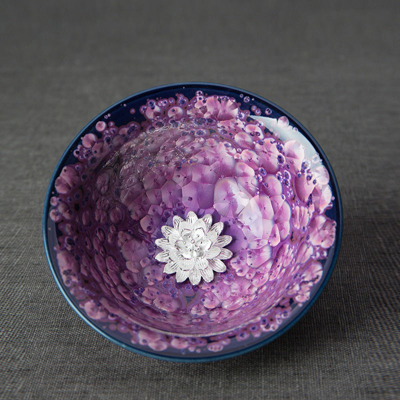 Close-up of the Jianzhan tea cup highlighting its unique texture and beautiful purple glaze.