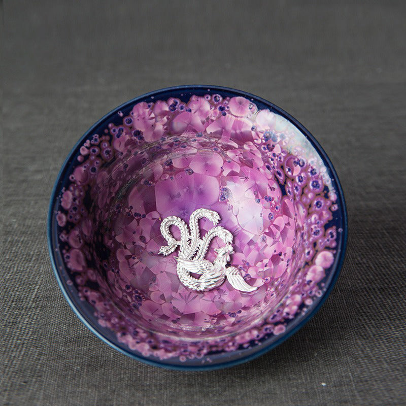 Side view of the elegant handmade Jianzhan purple tea cup showcasing sterling silver interior.