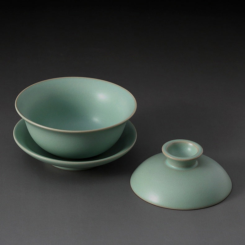 Using the gaiwan to brew tea, showing pouring technique