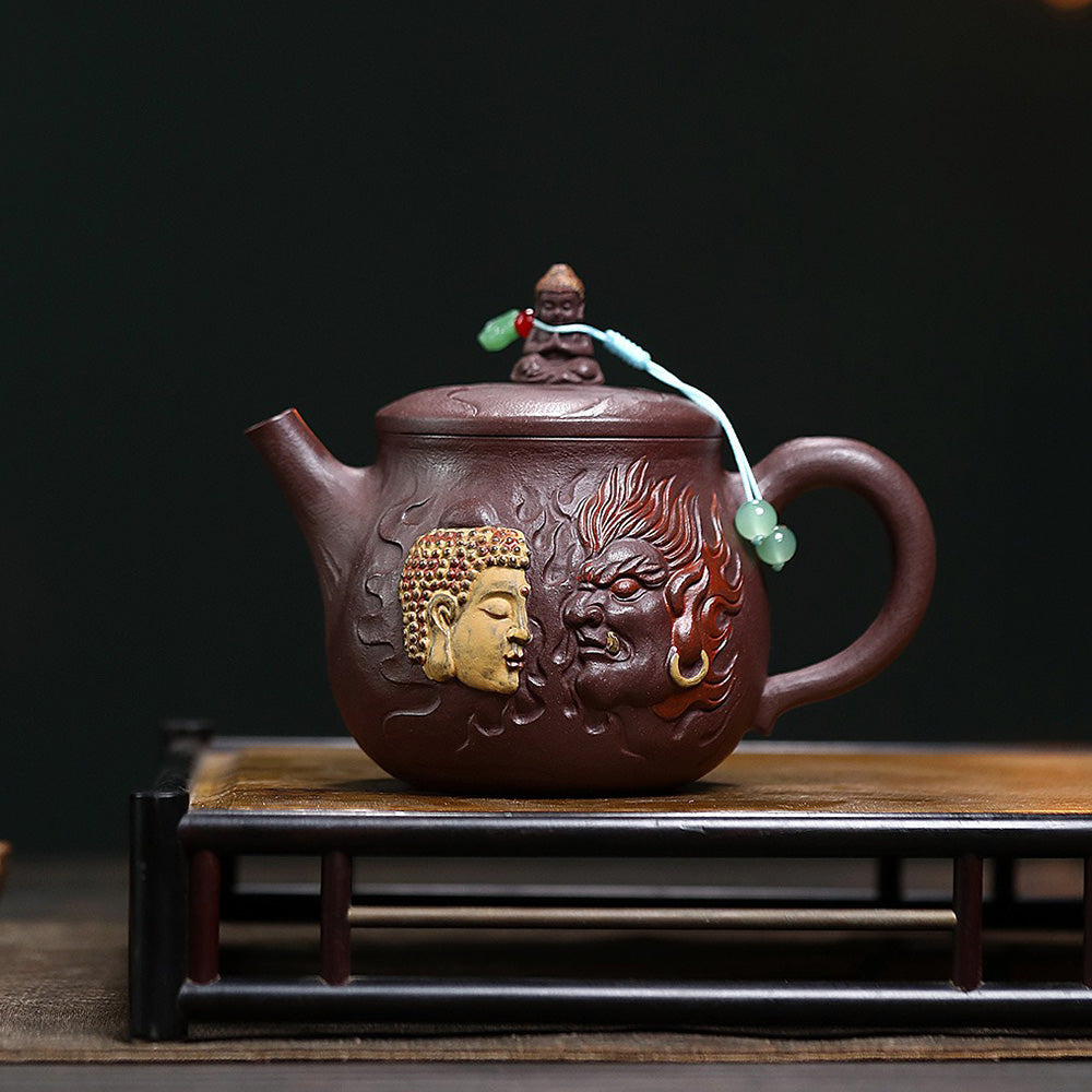 Elegant Hanwa purple clay teapot with Buddha relief, showcasing a unique artistic design.