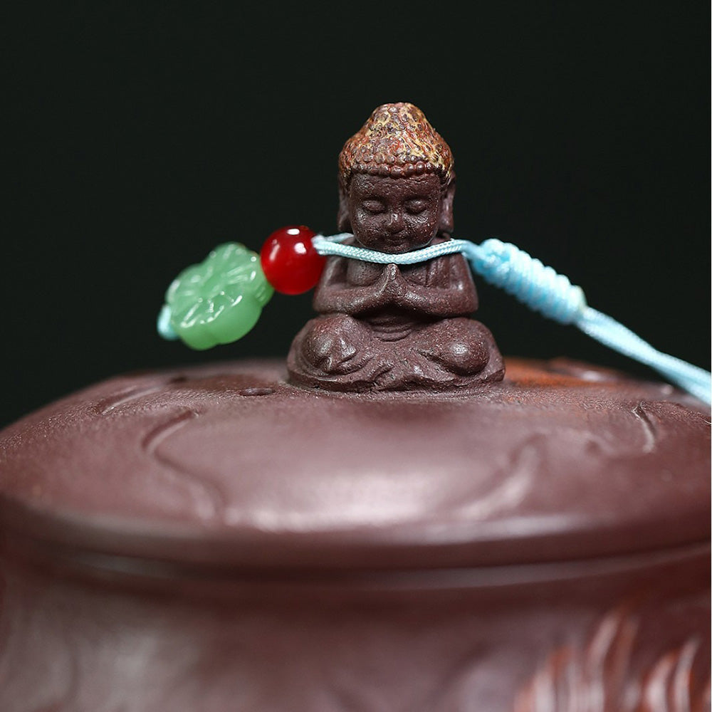 Close-up view of the purple clay Buddha teapot, highlighting its smooth finish and intricate details.