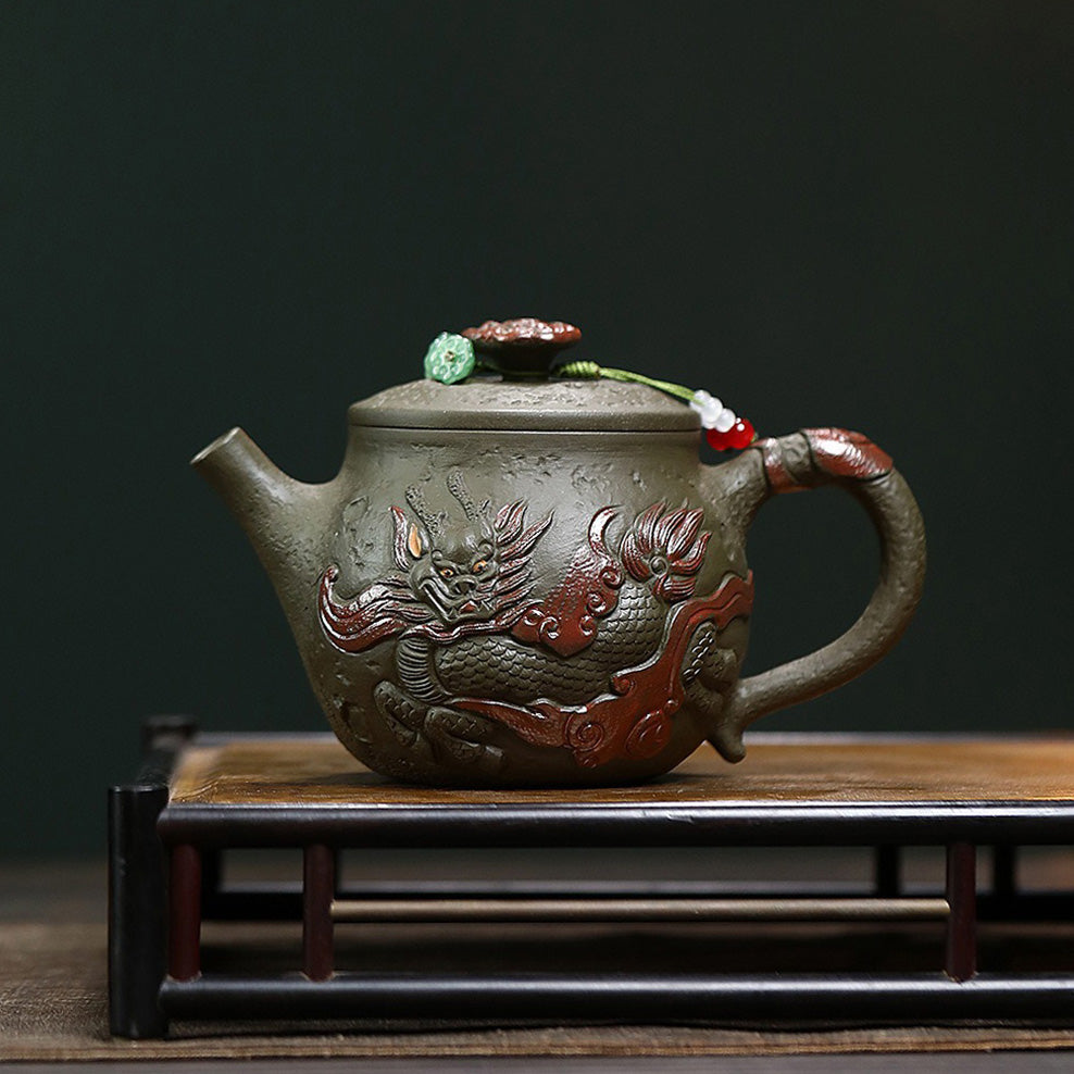 Close-up of Hanwa dark green clay teapot with dragon design, showcasing detailed craftsmanship