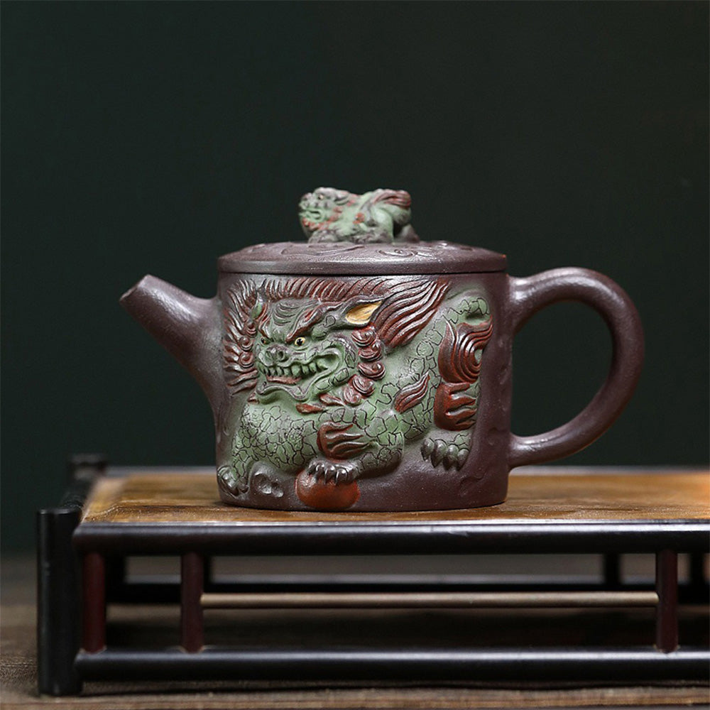 Close-up of Yixing purple clay teapot with kirin design, showcasing craftsmanship