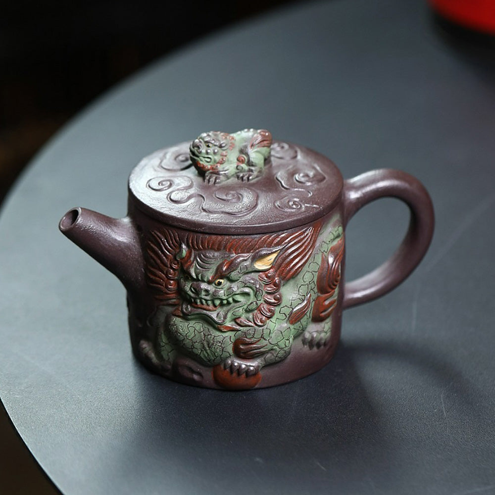 Close-up of Yixing purple clay teapot with kirin design, showcasing craftsmanship