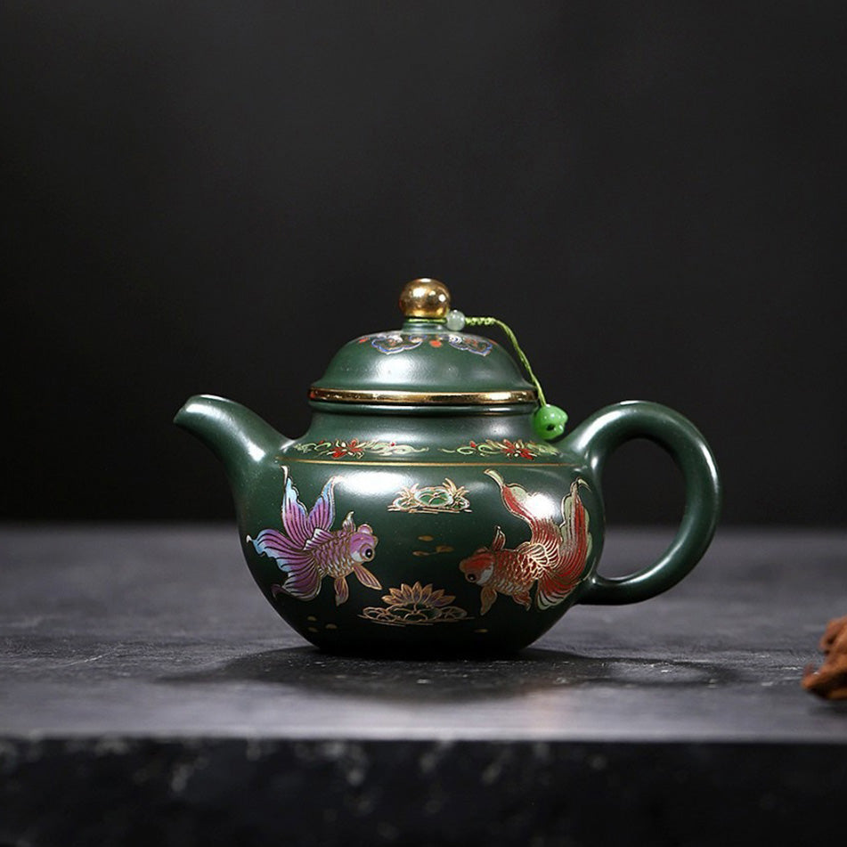 Close-up of the goldfish design on the Yixing green clay teapot