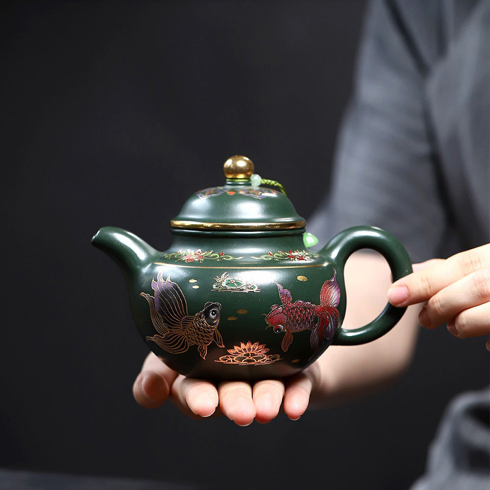 Close-up of the goldfish design on the Yixing green clay teapot