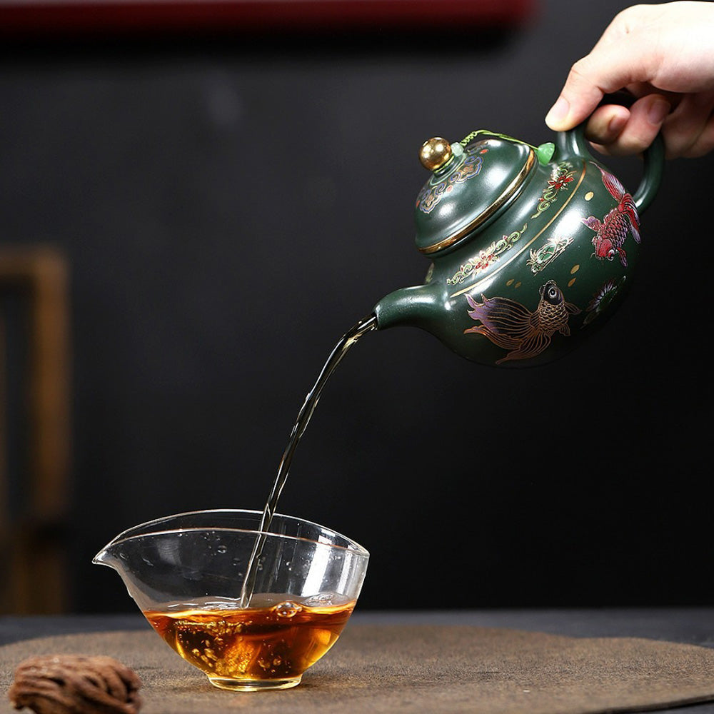 Close-up of the goldfish design on the Yixing green clay teapot