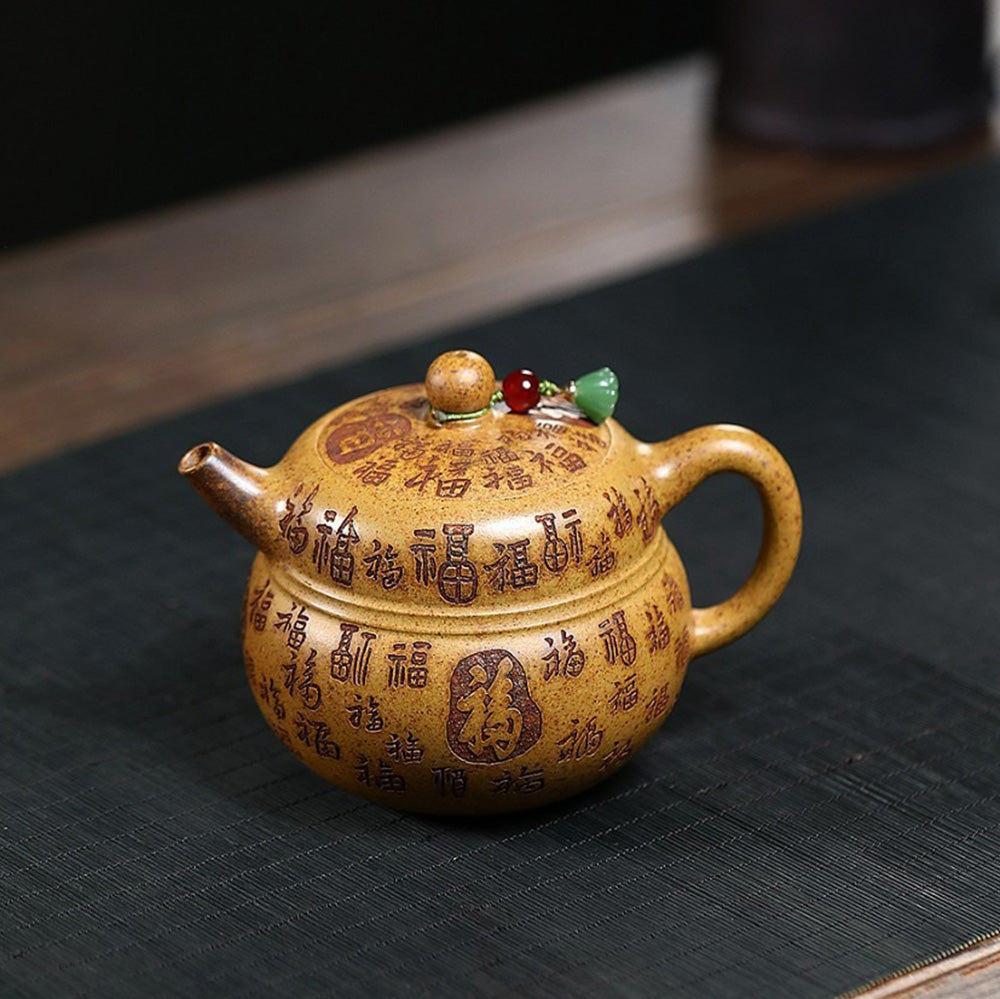 Tea being poured from the exquisite clay teapot into a cup, highlighting craftsmanship