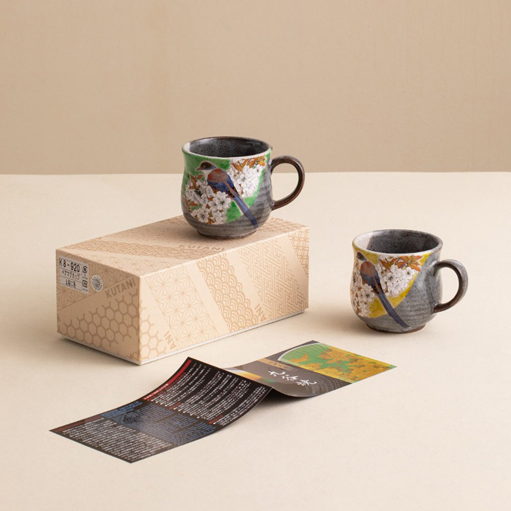 Close-up of the handmade cherry blossom and bird Kutani tea cup, highlighting intricate patterns.