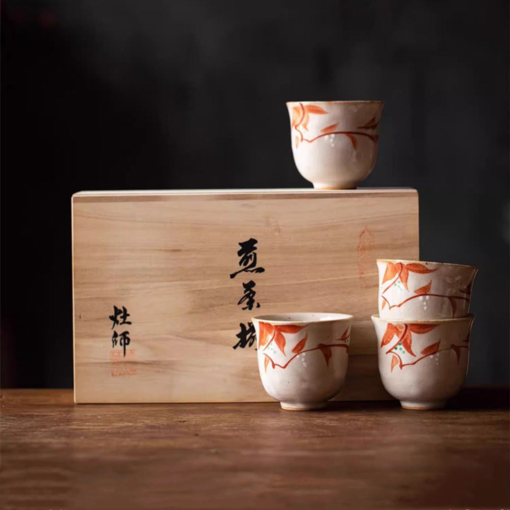Tea cups from the Japanese Flower Dance set on a rustic wooden table, ready for a relaxed tea time.