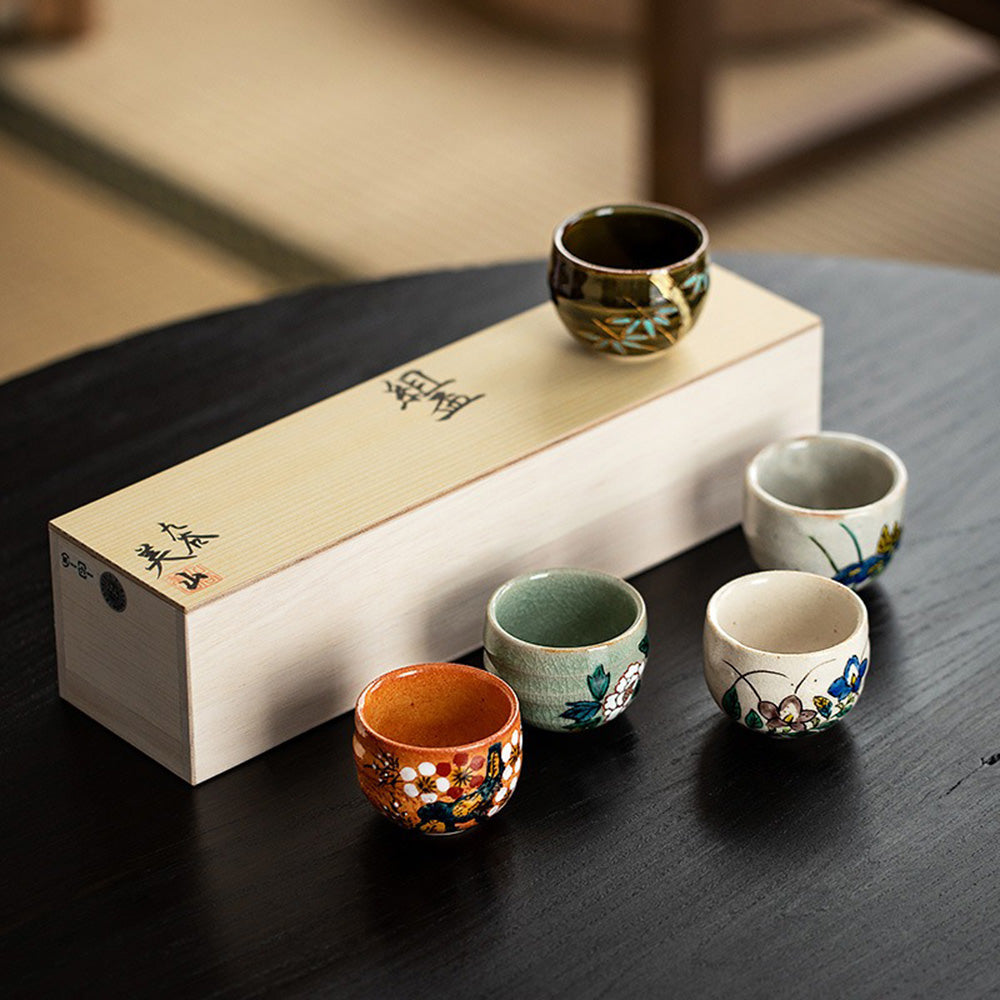 Close-up of the hand-painted Kutani tea cups showcasing intricate floral designs.