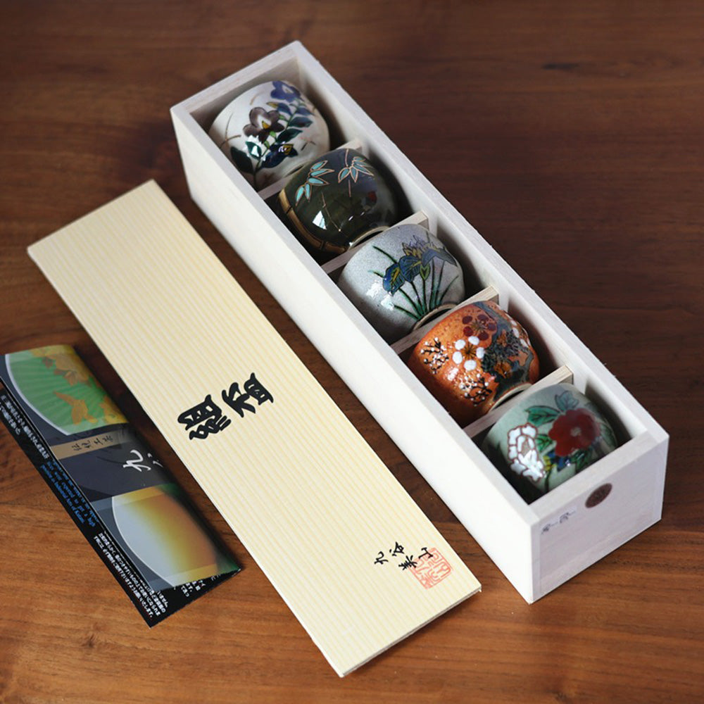 Elegant presentation of the Kutaniyaki tea cup set in a paulownia gift box.