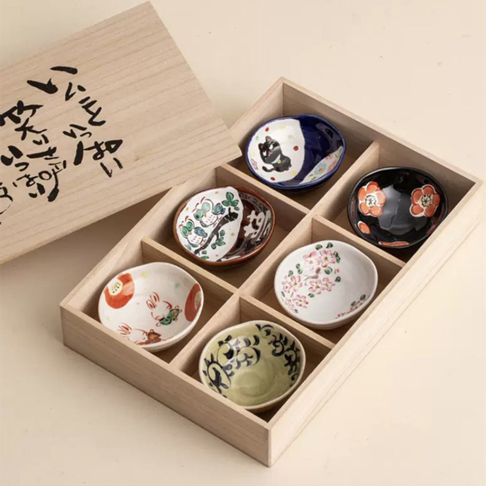 Close-up of Japanese Yudachi kiln serving bowls showcasing colorful patterns.