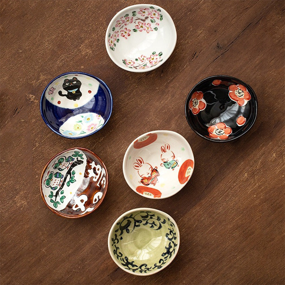 Close-up of Japanese Yudachi kiln serving bowls showcasing colorful patterns.
