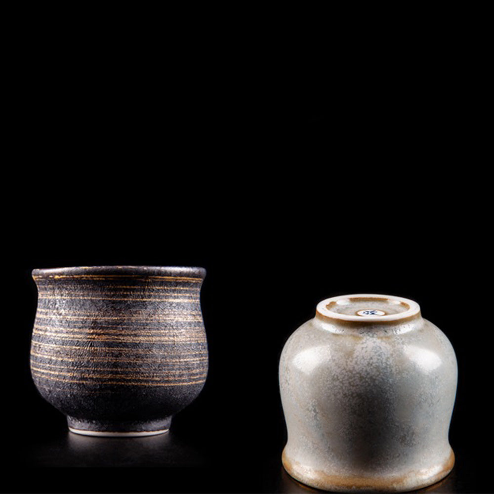 Elegant Hasami ware Tianmoku tea cup from an angle showing its unique glaze pattern.