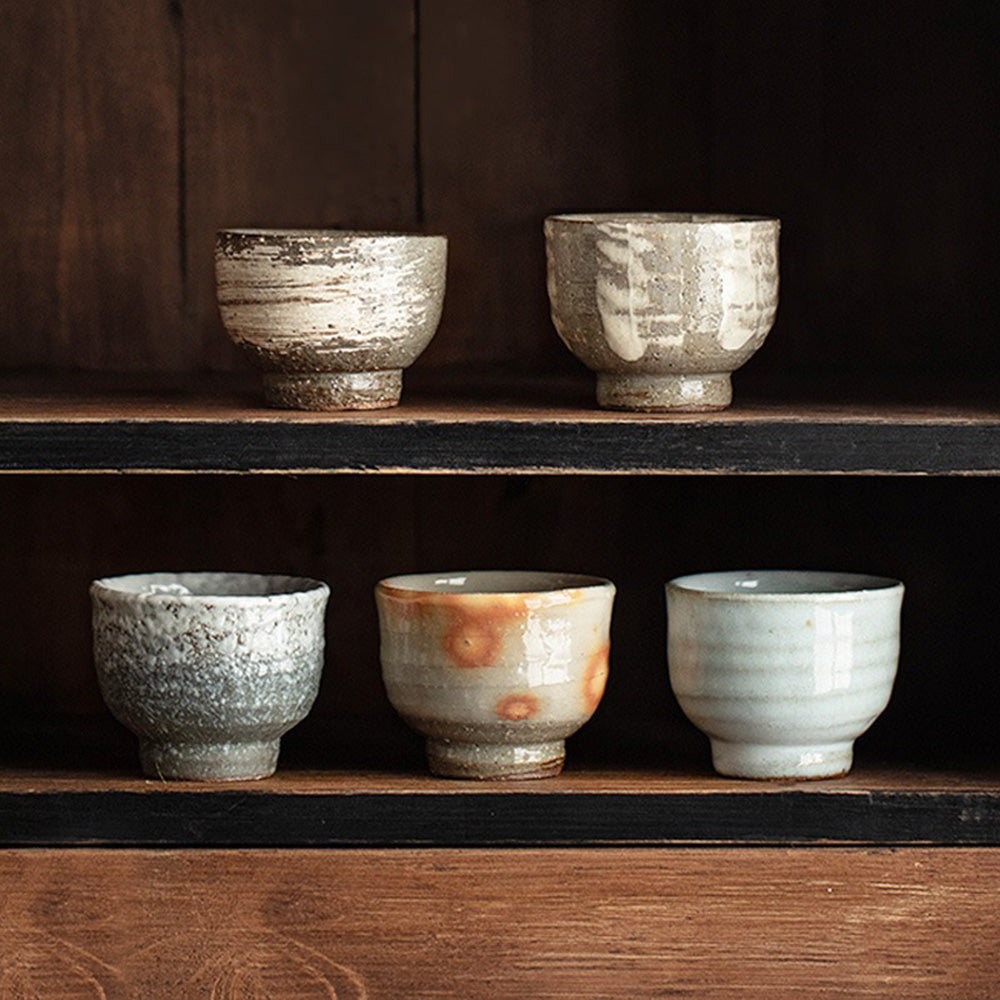Artistic angle of a single Wango-yaki tea cup featuring traditional Japanese pottery design.