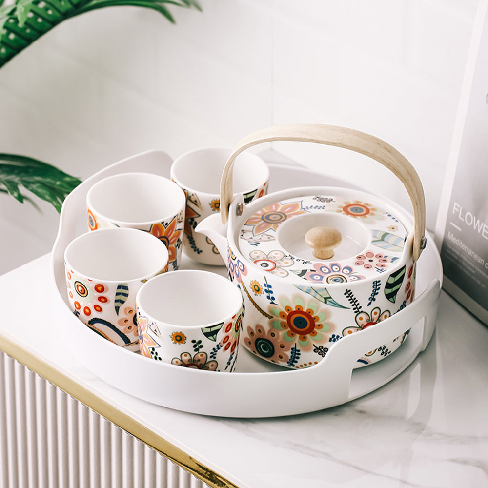 Teapot of the Charming Floral Ceramic Tea Set showing vibrant floral patterns.