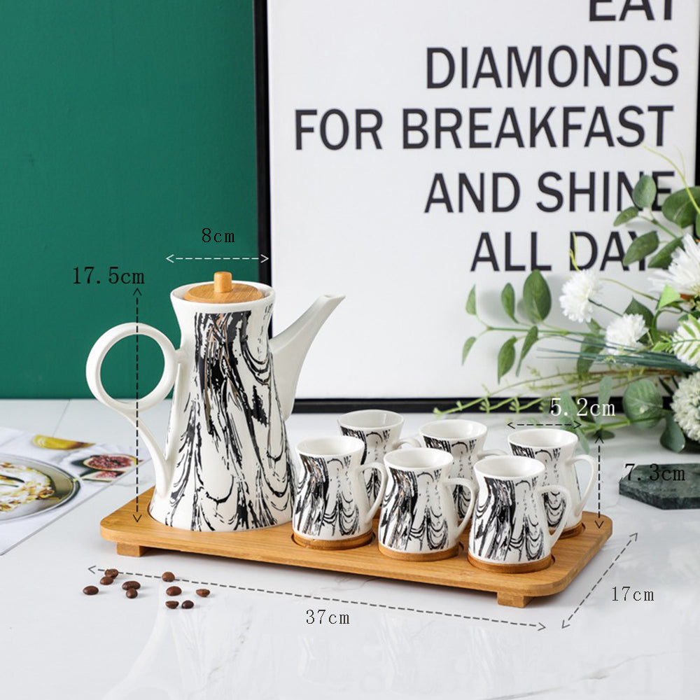 Minimalist ceramic tea cups on a bamboo tray, ideal for office use.