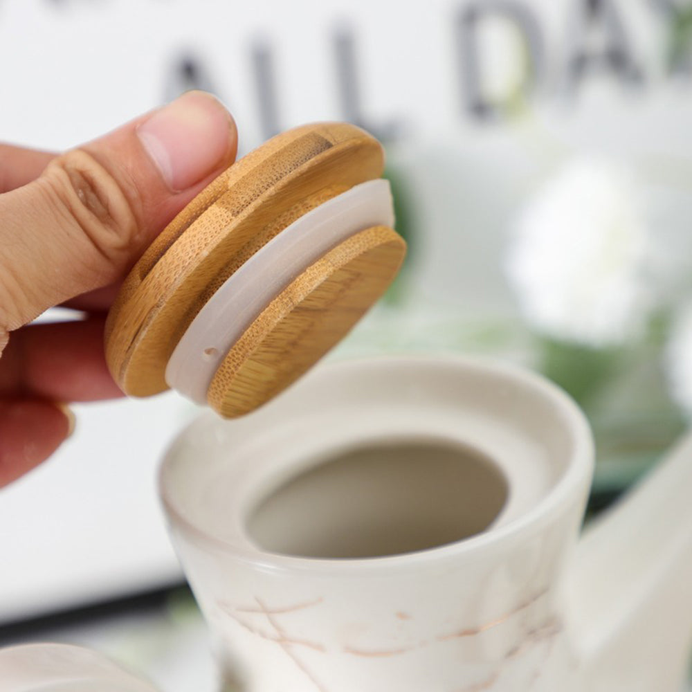 Minimalist ceramic tea cups on a bamboo tray, ideal for office use.