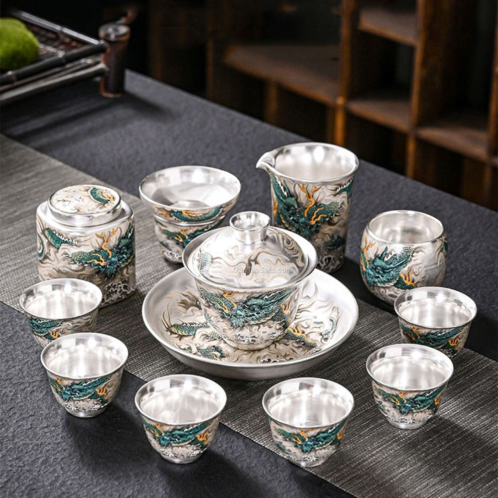 Close-up of hand-painted blue dragon on sterling silver tea set