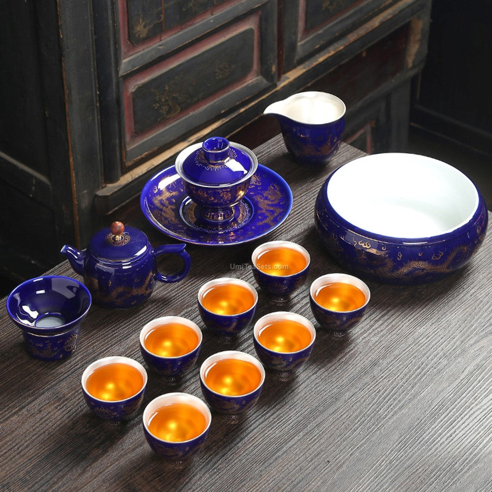 Top-down view of the Chinese tea set arranged for a traditional ceremony, showcasing the gold dragon and phoenix design.