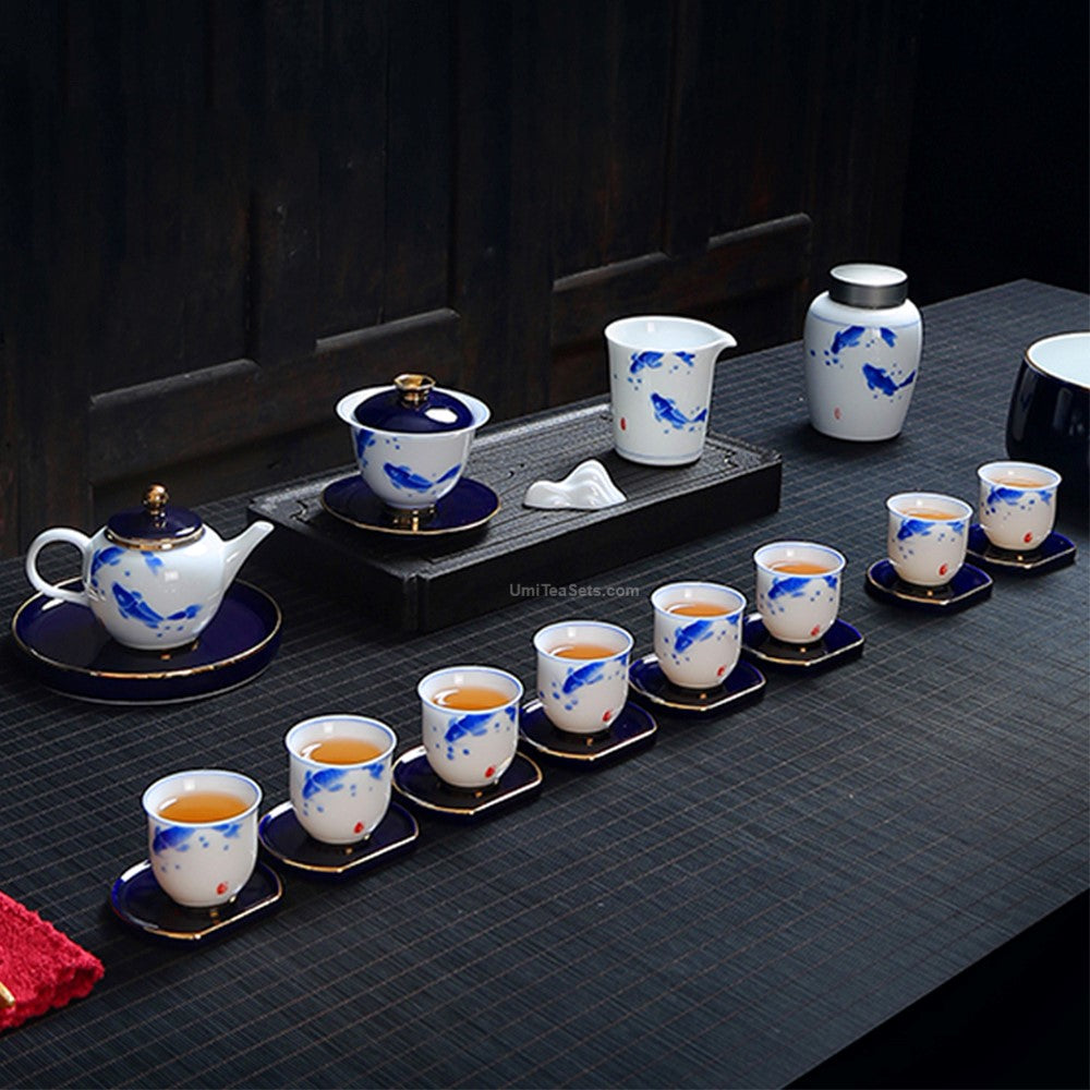 Close-up of hand-painted goldfish pattern on porcelain tea set showing intricate details